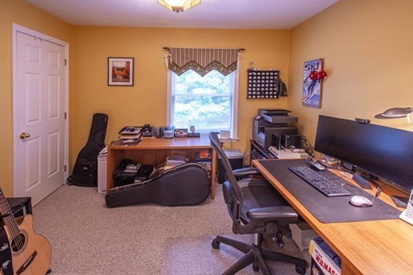 888 Florence Road Northampton, MA 01062 - Photo 32 of 37 a view of a workspace with furniture and a window