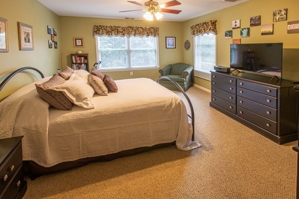 888 Florence Road Northampton, MA 01062 - Photo 33 of 37 a bedroom with a bed and a flat tv screen on dresser