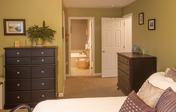 888 Florence Road Northampton, MA 01062 - Photo 34 of 37 a bedroom with a bed and a flat screen tv