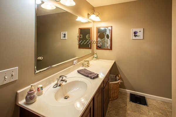 888 Florence Road Northampton, MA 01062 - Photo 36 of 37 a bathroom with a sink and a mirror
