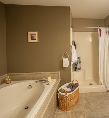 888 Florence Road Northampton, MA 01062 - Photo 37 of 37 a bathroom with a tub a window and couch