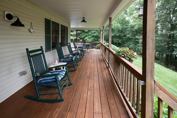 888 Florence Road Northampton, MA 01062 - Photo 4 of 37 a view of balcony with chairs and wooden floor