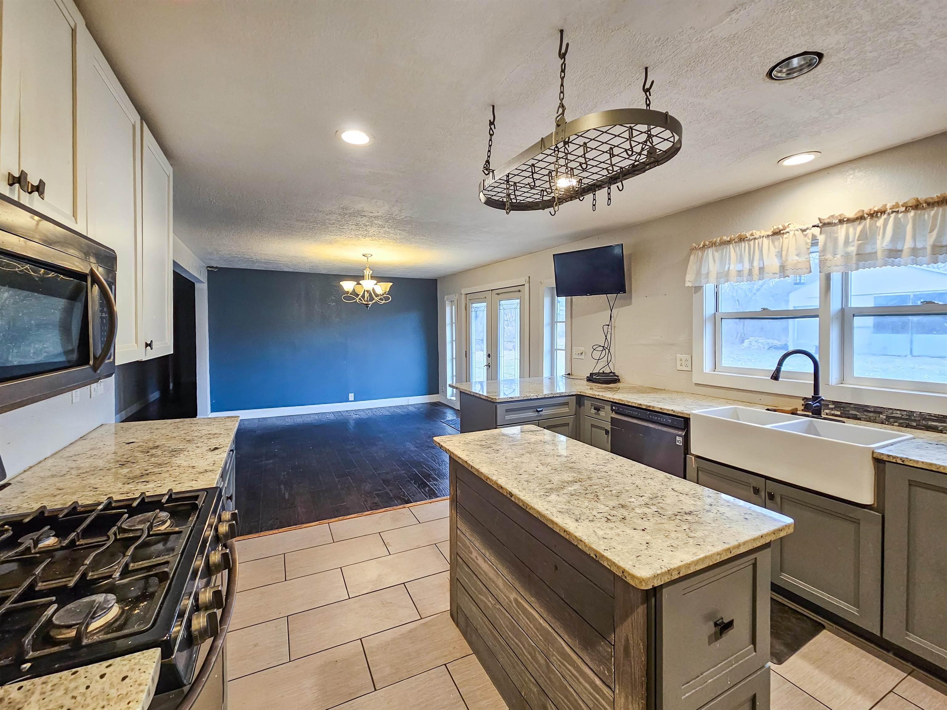 10582 Atwood Road Roscoe, IL 61073 - Photo 12 of 27 a kitchen with a stove a sink and a refrigerator