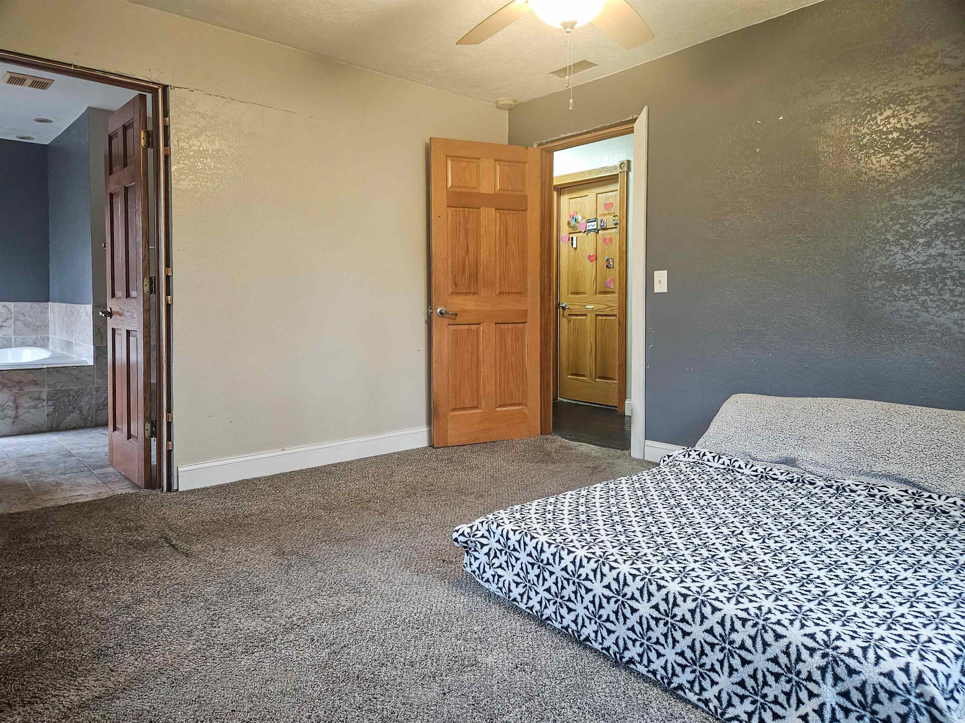 10582 Atwood Road Roscoe, IL 61073 - Photo 20 of 27 a bedroom with a bed and wooden floor