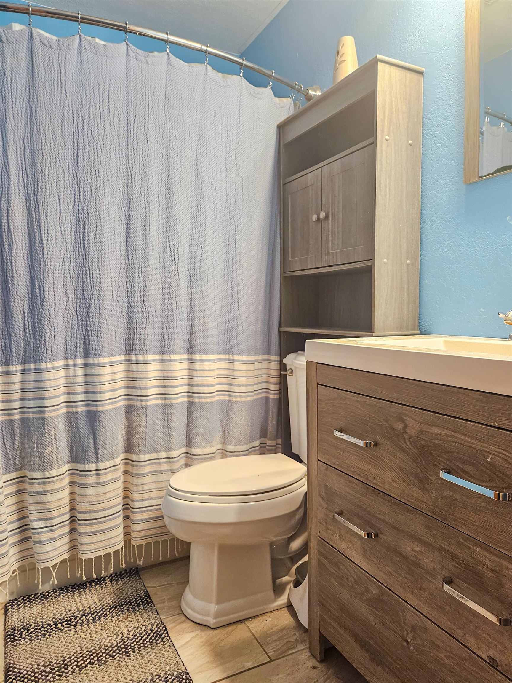 10582 Atwood Road Roscoe, IL 61073 - Photo 24 of 27 a bathroom with a sink a toilet and shower