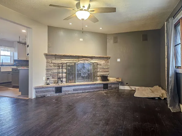 a room with fireplace and furniture