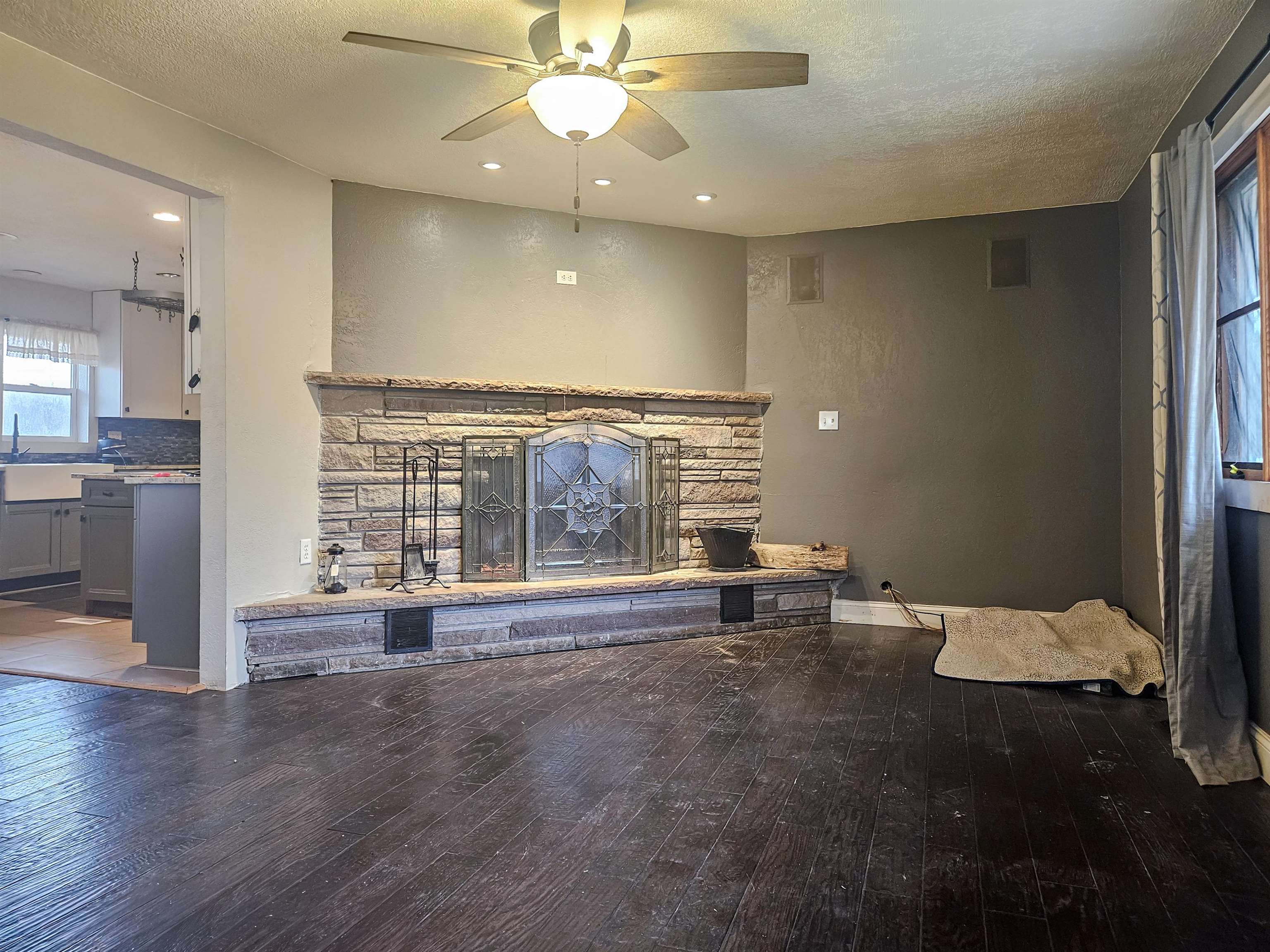 10582 Atwood Road Roscoe, IL 61073 - Photo 5 of 27 an empty room with wooden floor and windows