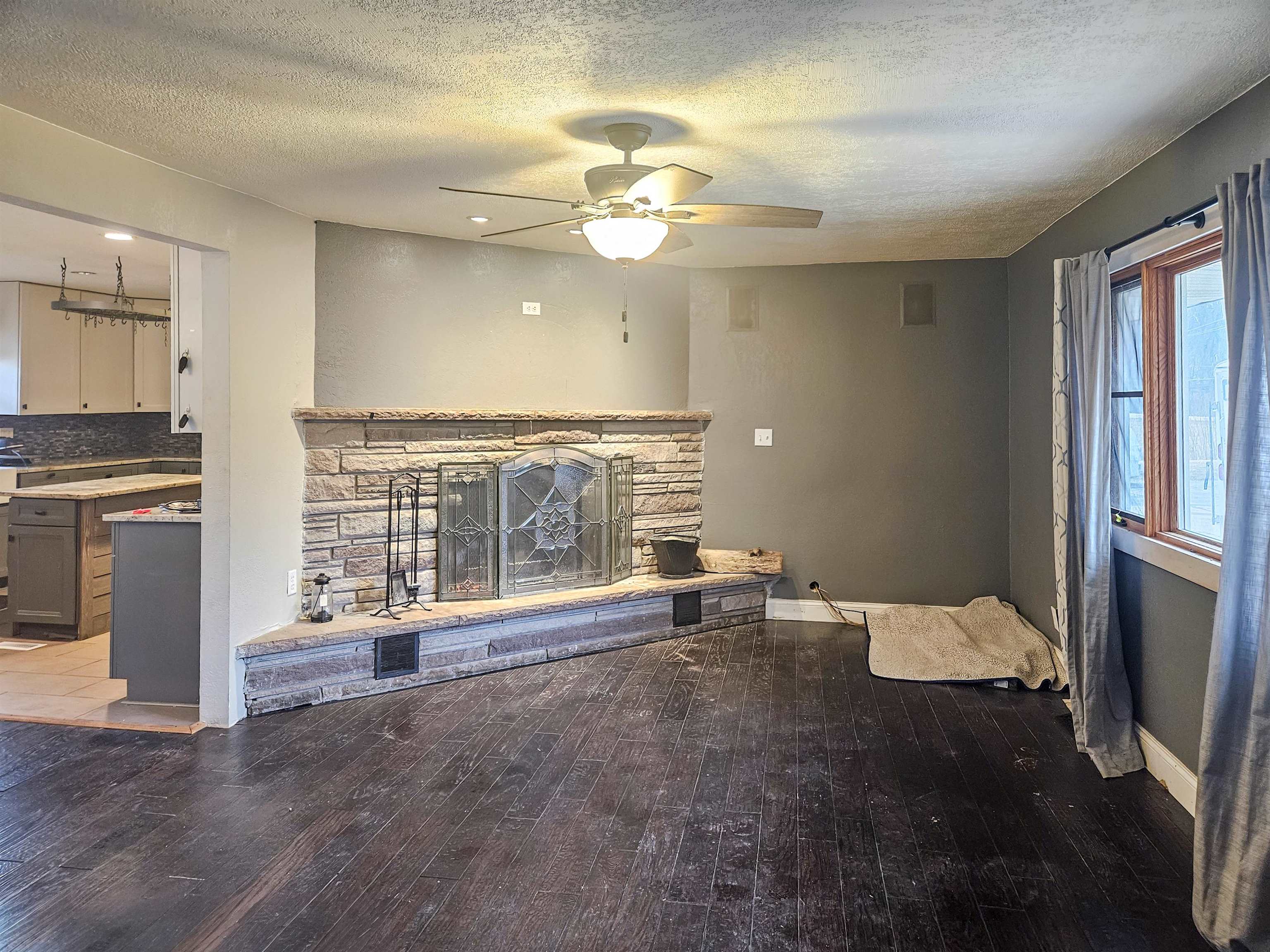 10582 Atwood Road Roscoe, IL 61073 - Photo 7 of 27 a view of an empty room with a fireplace