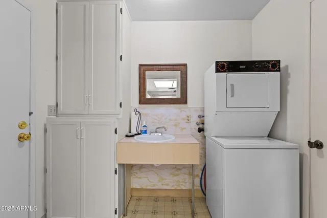 a bathroom with a sink toilet and tub