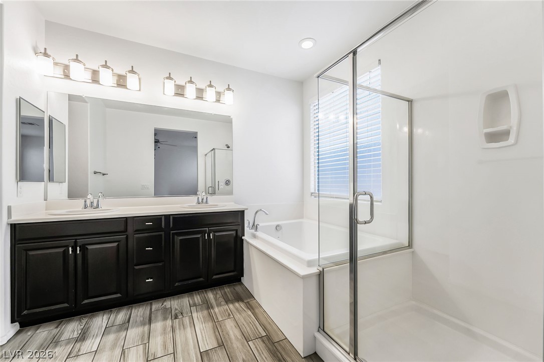 6245 Andover Wood Road Las Vegas, NV 89113 - Photo 20 of 37 Indulge in a tranquil bathing experience with a soaking tub and a separate glass-enclosed shower.