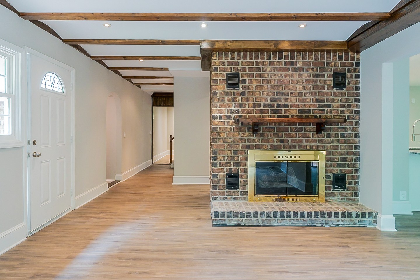 4839 Kinneys School Road Springfield, TN 37172 - Photo 3 of 35 a view of an empty room with wooden floor and a fireplace
