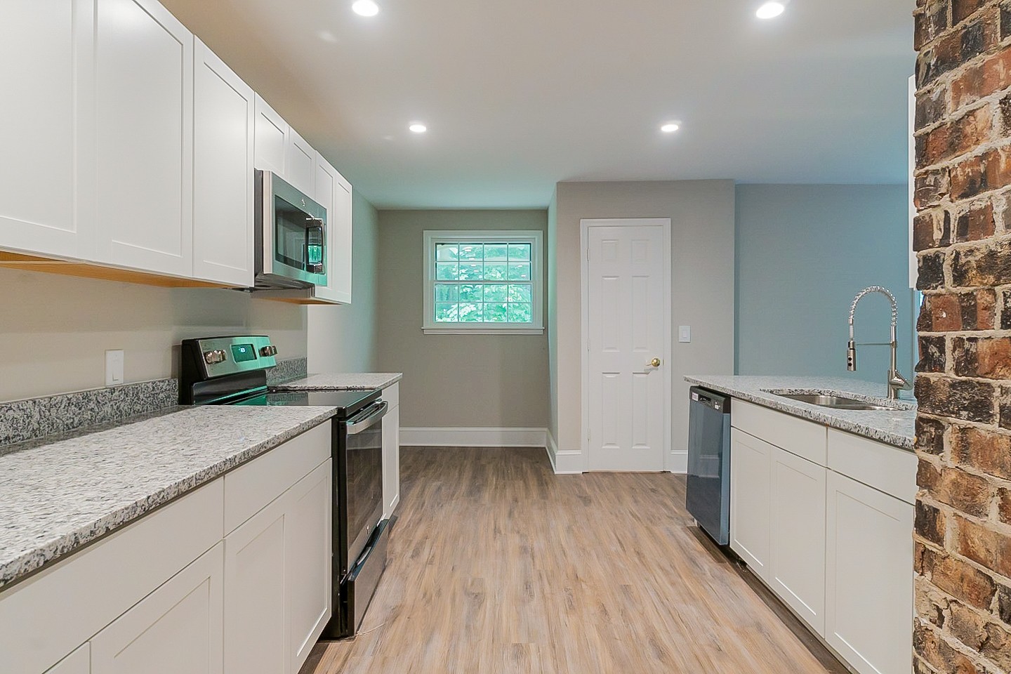 4839 Kinneys School Road Springfield, TN 37172 - Photo 6 of 35 a kitchen with a sink and wooden floor