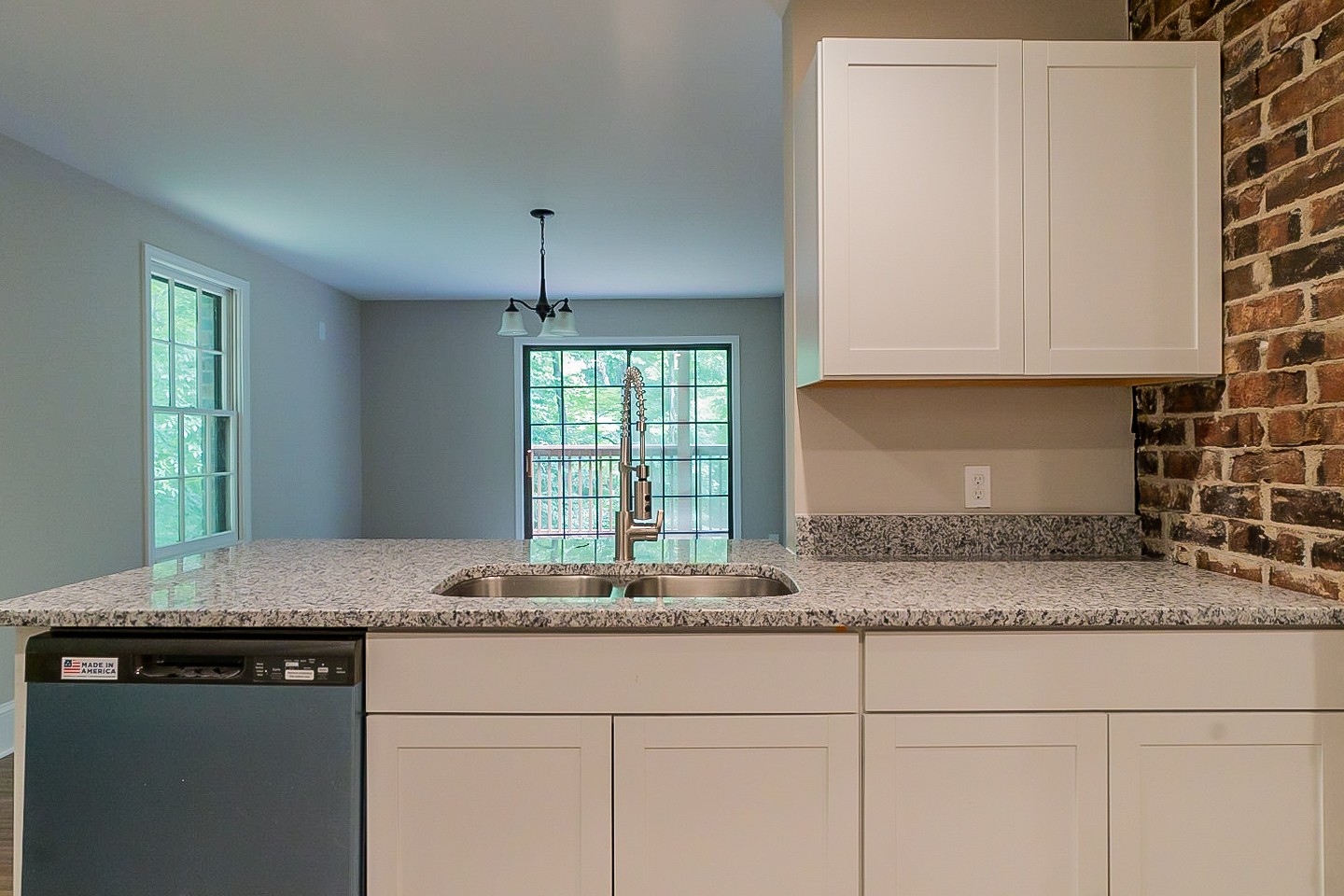4839 Kinneys School Road Springfield, TN 37172 - Photo 7 of 35 a kitchen with granite countertop a sink a stove cabinets and a counter top space