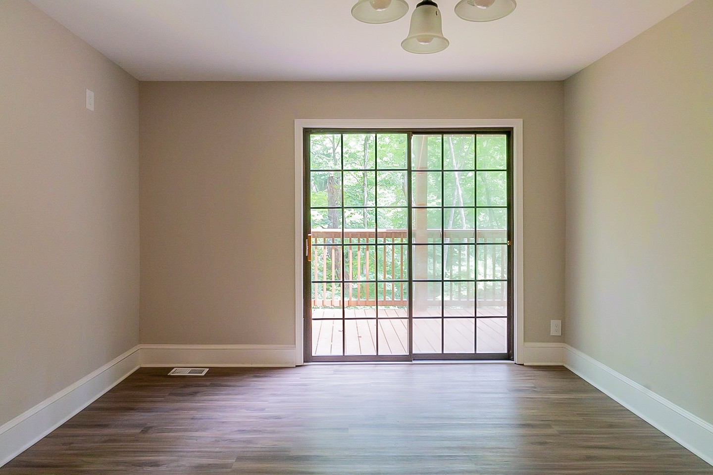 4839 Kinneys School Road Springfield, TN 37172 - Photo 9 of 35 an empty room with wooden floor and windows