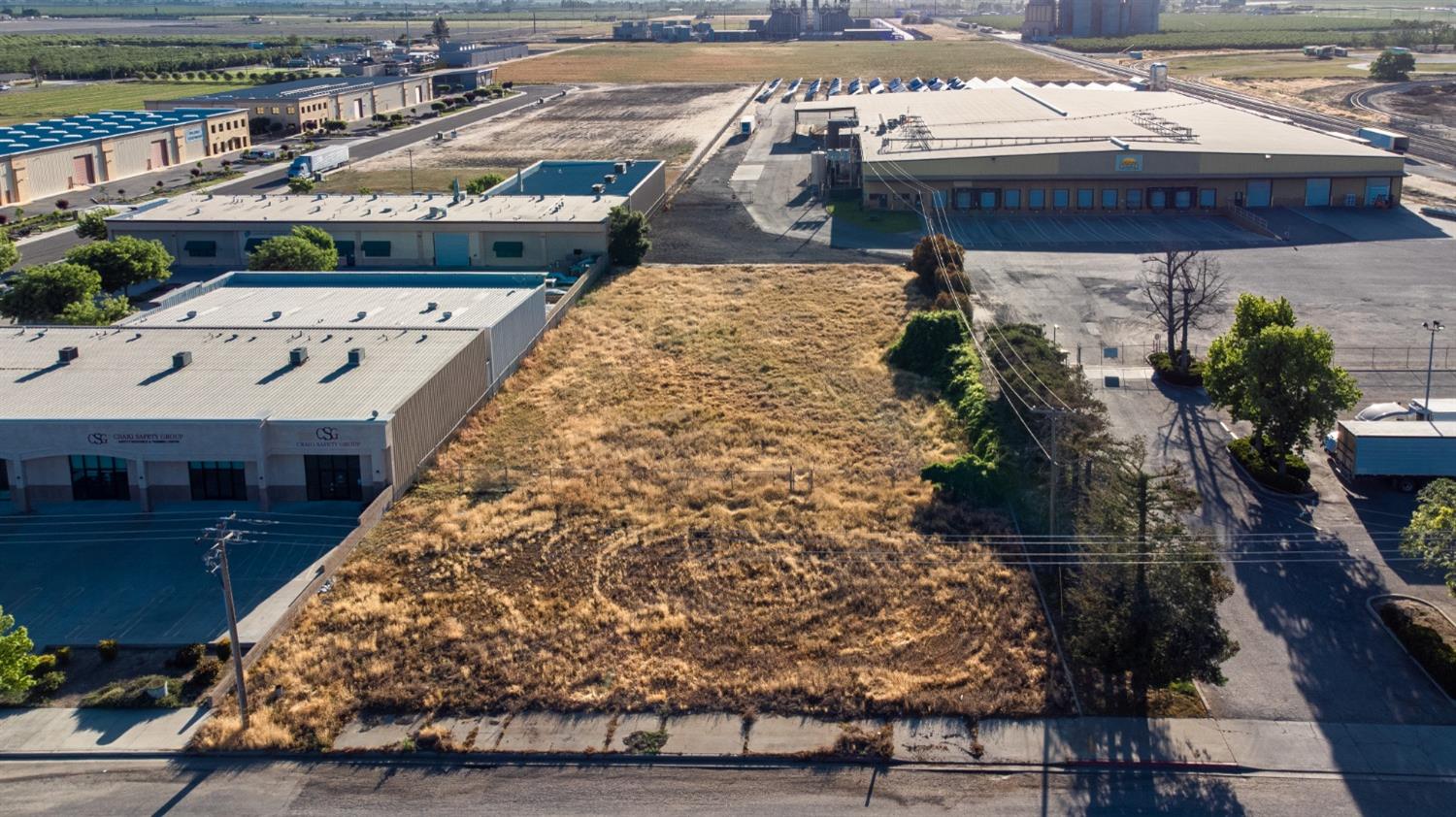 607 South Tegner Road Turlock, CA 95380 - Photo 5 of 5 a terrace with outdoor seating and wooden floor