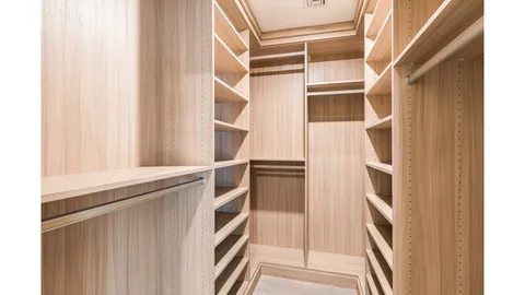 a view of an empty walk in closet