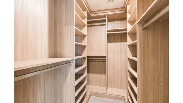 a view of an empty walk in closet