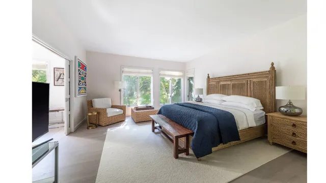 a bedroom with a bed and a couch