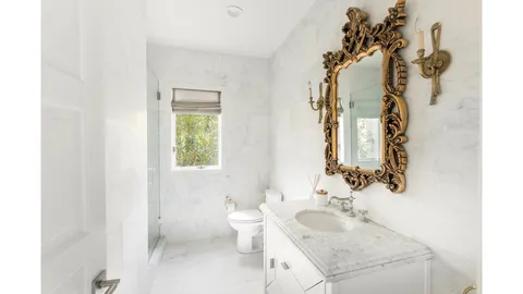 a bathroom with a sink and toilet