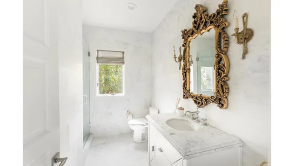 a bathroom with a sink and toilet