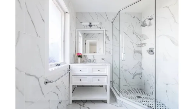 a bathroom with a sink a mirror and a shower