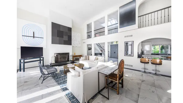 a living room with fireplace furniture and a fireplace