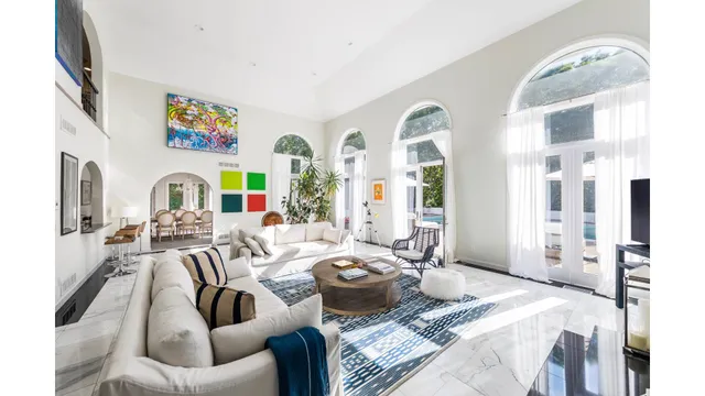 a view of a livingroom with furniture and window