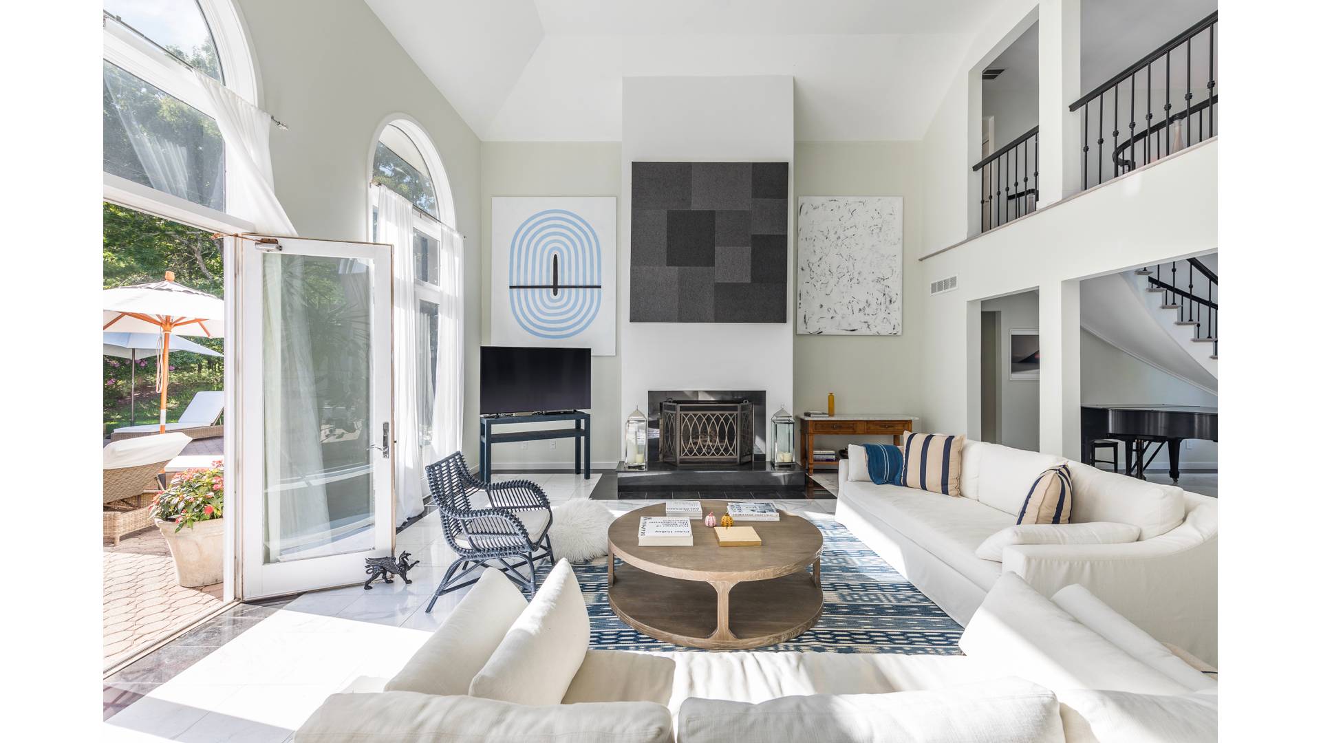 50 Tanager Lane Water Mill, NY 11976 - Photo 7 of 29 a living room with furniture a fireplace and a large window