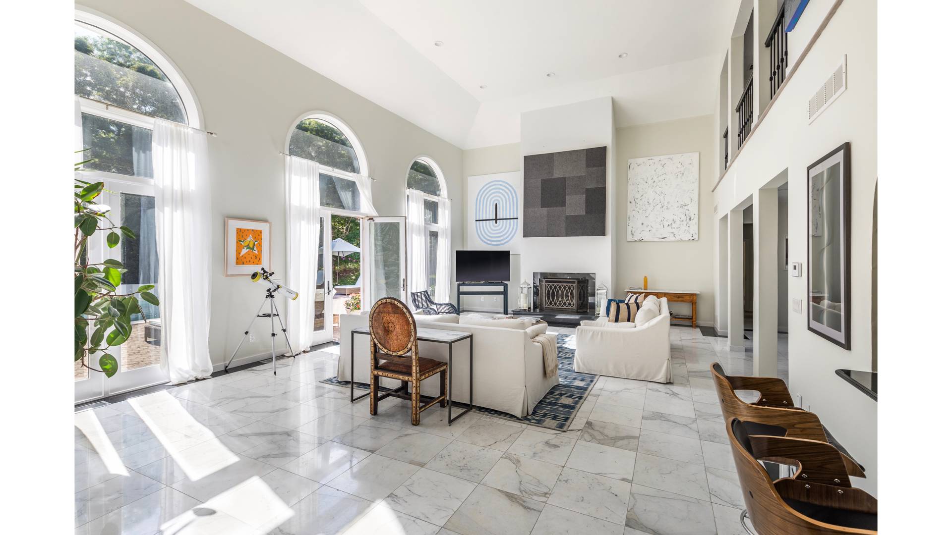 50 Tanager Lane Water Mill, NY 11976 - Photo 8 of 29 a living room with furniture a fireplace and a flat screen tv