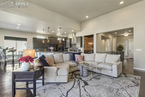 a living room with furniture kitchen and kitchen view