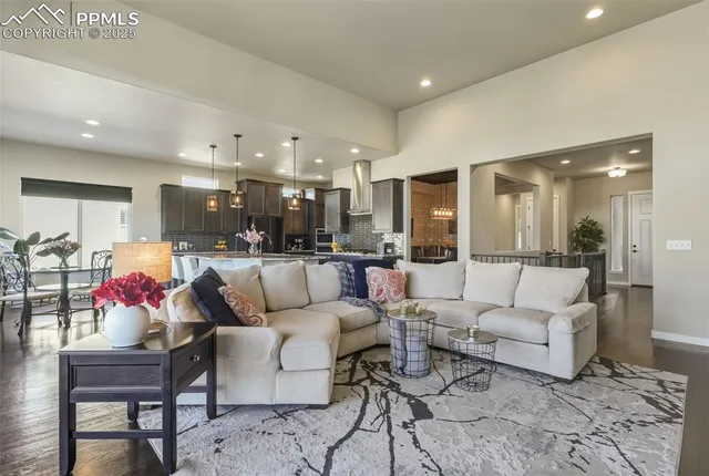 a living room with furniture kitchen and kitchen view