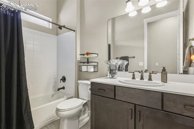 a bathroom with a sink toilet tub and shower