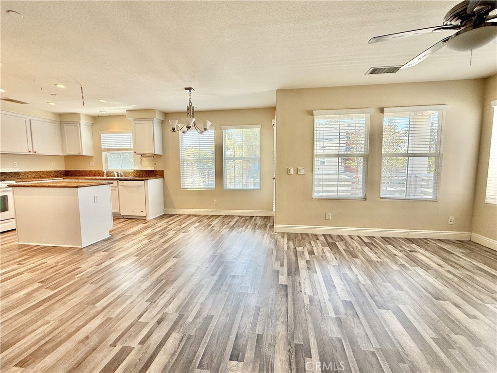 5 Quartz Lane Ladera Ranch, CA 92694 - Photo 10 of 55 Open living kitchen/dining/living. Newer luxury vinyl flooring on stairs and second and third levels