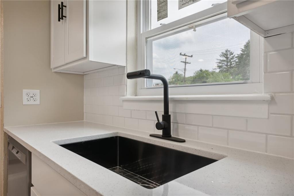 428 Beulah Road Pittsburgh, PA 15235 - Photo 12 of 39 a kitchen with a sink and dishwasher