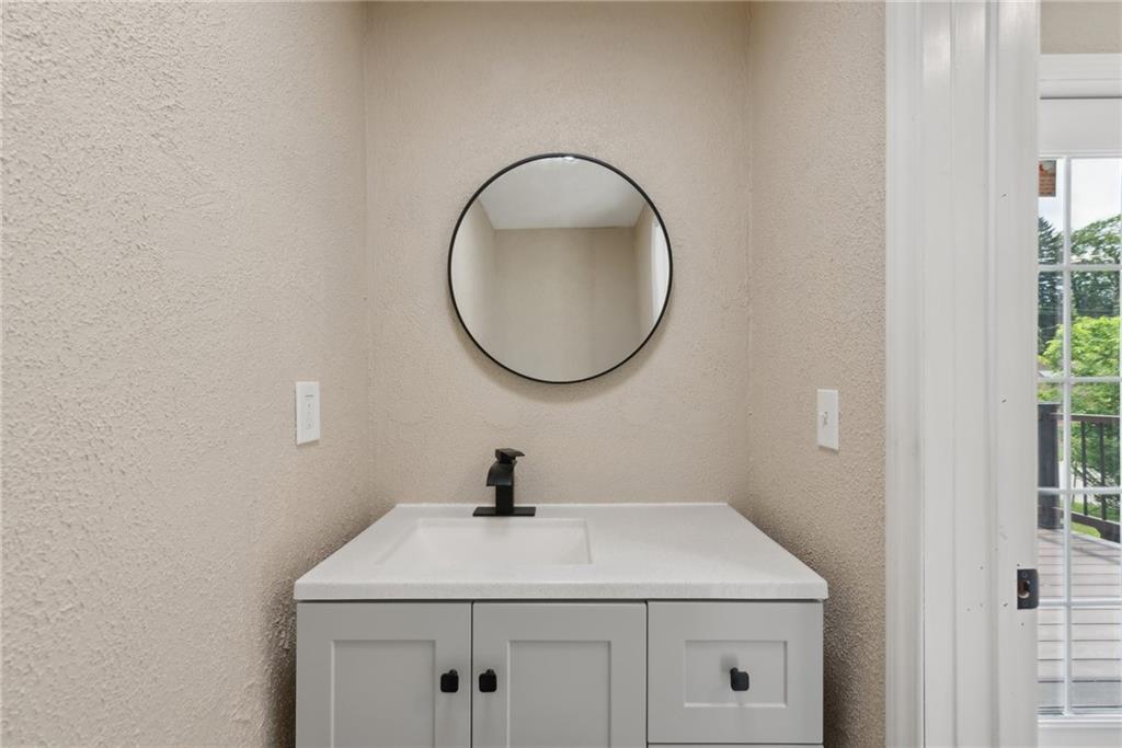 428 Beulah Road Pittsburgh, PA 15235 - Photo 20 of 39 a bathroom with a sink and a mirror
