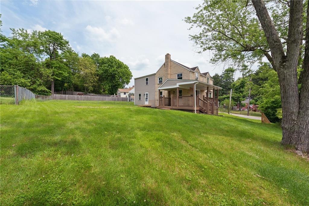 428 Beulah Road Pittsburgh, PA 15235 - Photo 2 of 39 a view of a house with a big yard and large tree