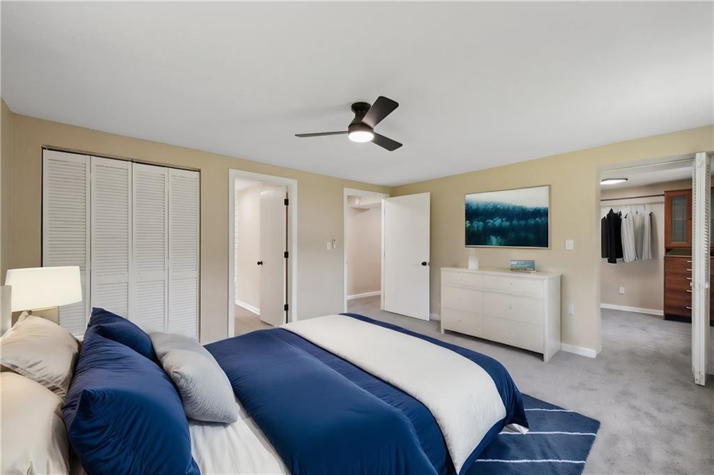 428 Beulah Road Pittsburgh, PA 15235 - Photo 21 of 39 a bedroom with a bed and a flat tv screen