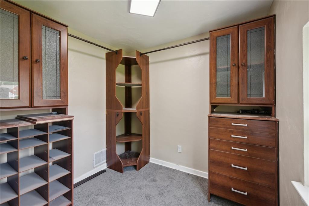 428 Beulah Road Pittsburgh, PA 15235 - Photo 23 of 39 a view of walk in closet with empty racks
