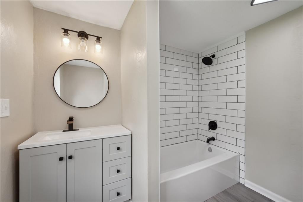 428 Beulah Road Pittsburgh, PA 15235 - Photo 24 of 39 a bathroom with a tub sink toilet and mirror