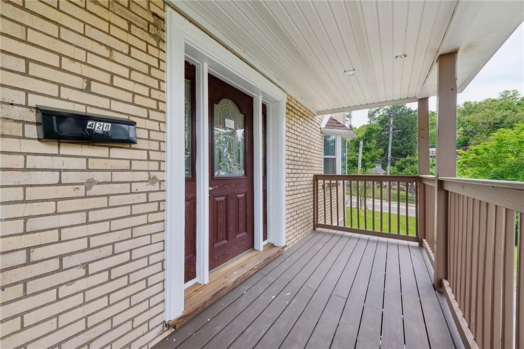 428 Beulah Road Pittsburgh, PA 15235 - Photo 3 of 39 a view of a porch with wooden floor and fence