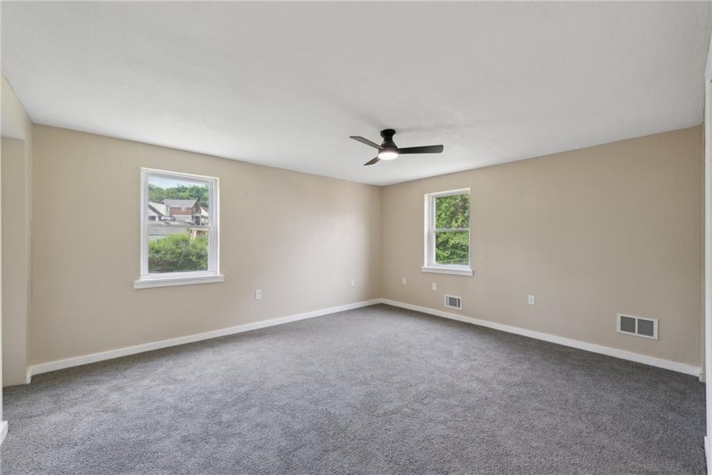 428 Beulah Road Pittsburgh, PA 15235 - Photo 31 of 39 a view of an empty room with a window