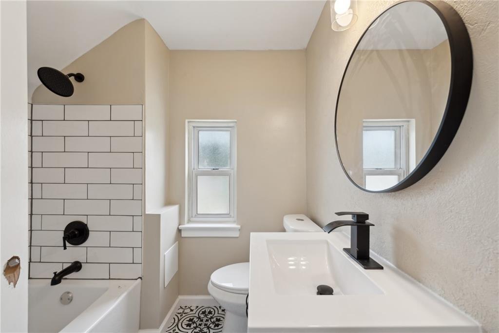 428 Beulah Road Pittsburgh, PA 15235 - Photo 33 of 39 a bathroom with a sink a toilet and a mirror