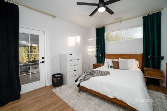 925 West Coronado Avenue Ridgecrest, CA 93555 - Photo 20 of 33 a bedroom with a bed and a window