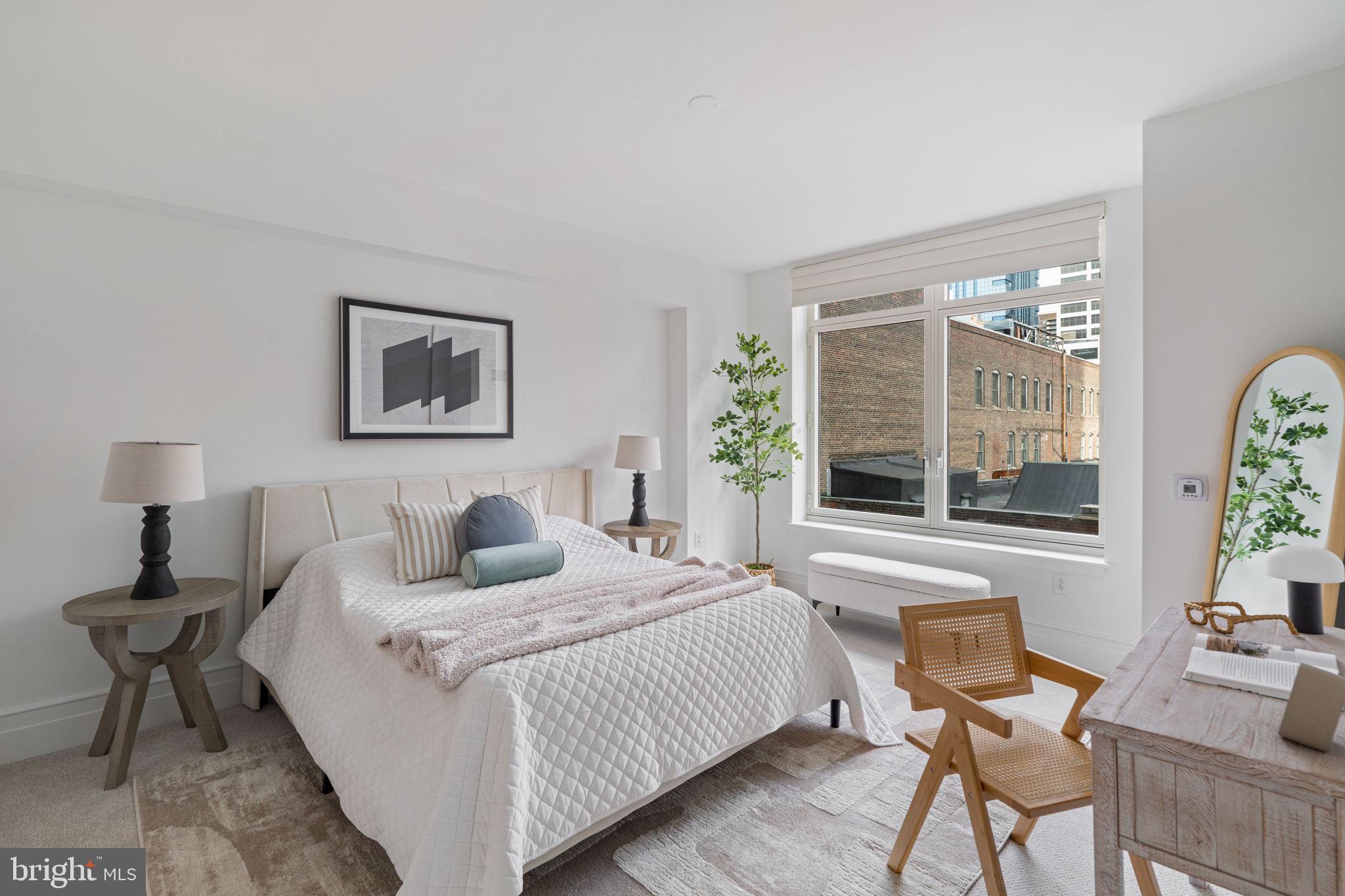 130 South 18th Street, Unit 501 Philadelphia, PA 19103 - Photo 20 of 43 a bedroom with a bed and a window