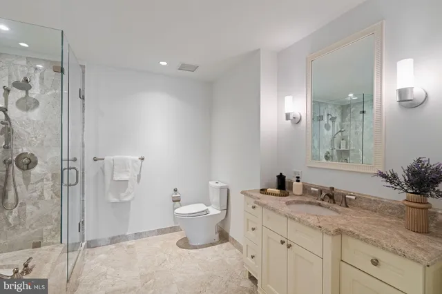 a bathroom with a bathtub and shower