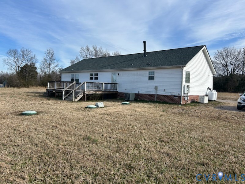 15910 Nobles Road Disputanta, VA 23842 - Photo 2 of 38 Back of property featuring a lawn, a wooden deck,