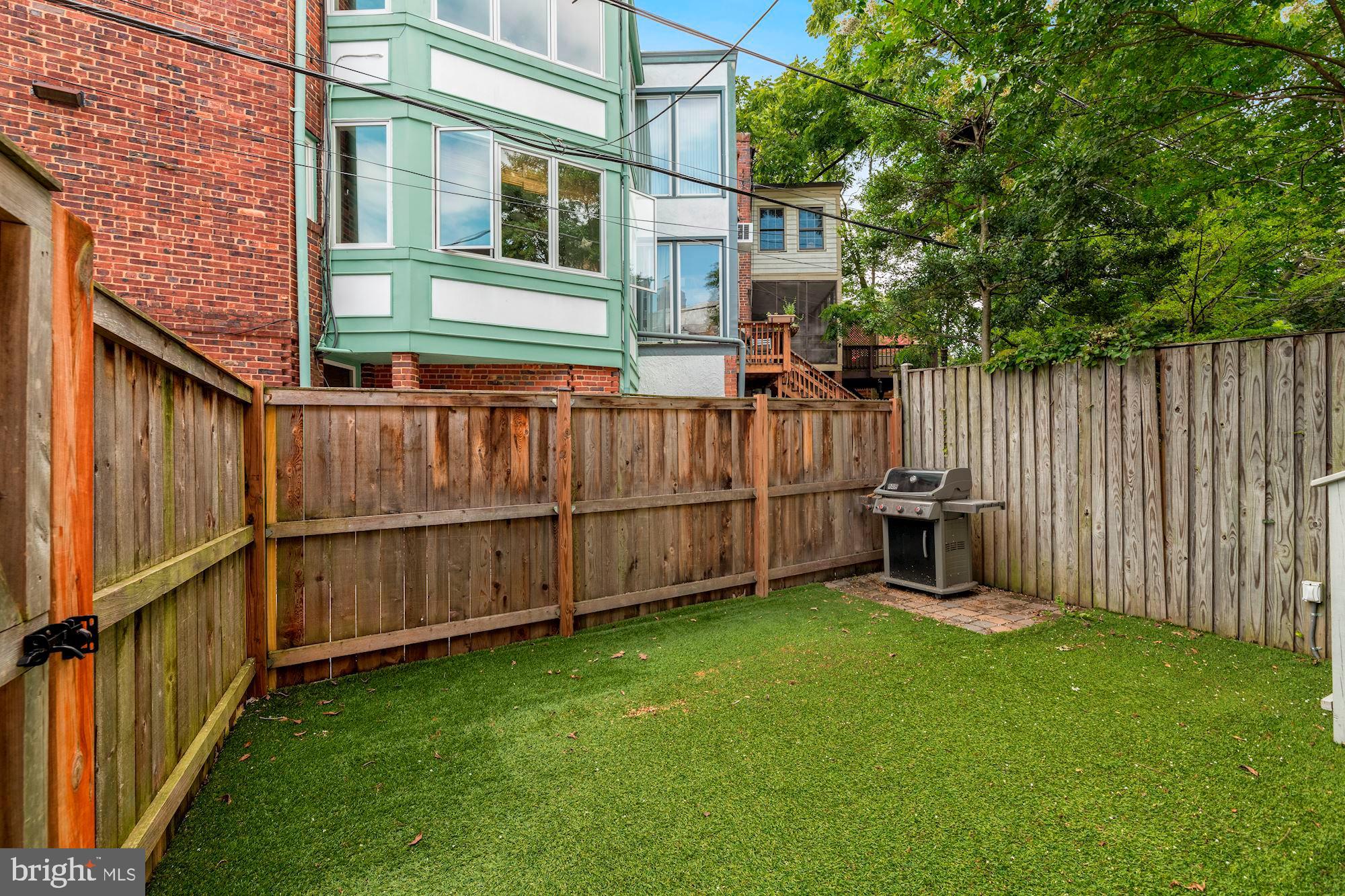 1540 44th Street Northwest Washington, DC 20007 - Photo 33 of 39 Rear, fenced hardscape yard.
