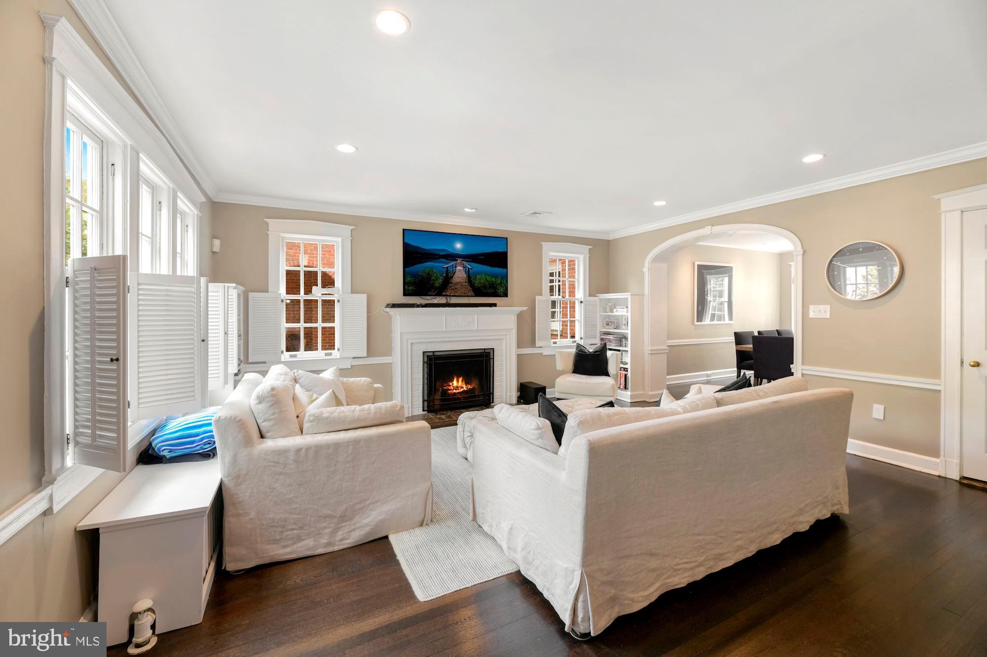 1540 44th Street Northwest Washington, DC 20007 - Photo 7 of 39 Walls of windows, flooded with light & fireplace!