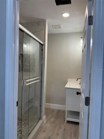 a bathroom with a sink and mirror