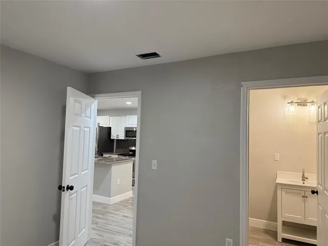 a view of a kitchen from the hallway